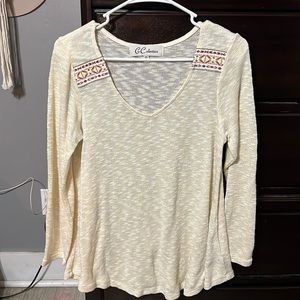 Green sweater with tribal detailing